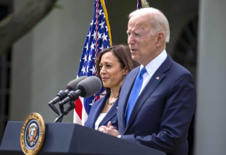 Kamala Harris listens as Joe Biden speaks in the Rose Garden at the White House in May.