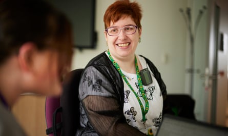 Jennifer Brown smiles as she listens to a participant in a self-advocacy class