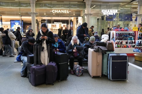 Eurostar passengers waiting at St Pancras International station in London today