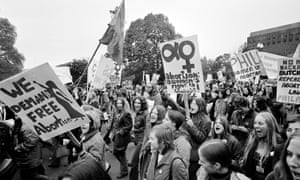 Demonstrators demanding a woman's right to choose march to the US Capitol for a rally seeking repeal of all anti-abortion laws in Washington DC, Nov 20, 1971.  On the other side of the Capitol was a demonstration held by those who are against abortion.  (AP Photo)