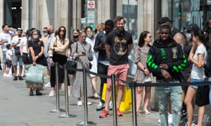 Customers wait in line to enter Topshop on Oxford Street, London, on 15 June, 2020