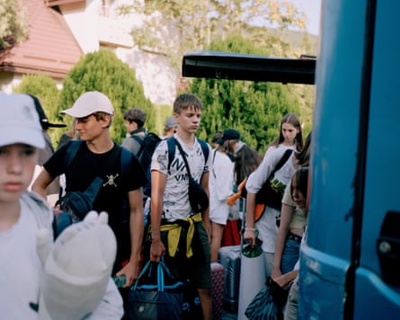 Dmymro, 15 pauses a second before loading his things onto the bus, that will take him back towards Kyiv. Friday, August, 1, 2025 Suskovo, Oblast, Ukraine