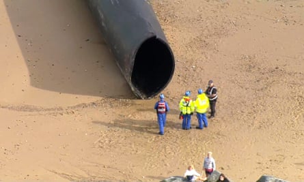 Section of the giant pipe washed up on the beach in Norfolk.