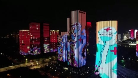 Wuhan pays tribute to key workers with light show as lockdown is lifted – video