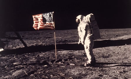 Buzz Aldrin with a nylon US flag planted on the moon in 1969.