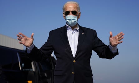 Joe Biden on the way to the final presidential debate at which he said his $2tn climate plan would create jobs.