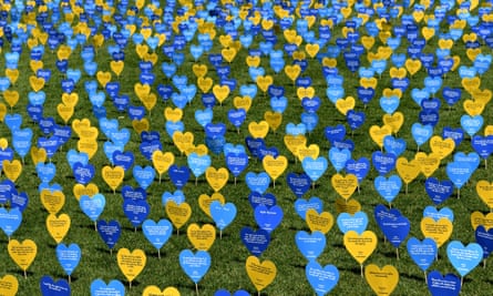 Thousands of heart-shaped cards in shades of blue and yellow, each with a message from someone who supports voluntary assisted dying laws, lay behind the lawns at Parliament House in Sydney, Australia
