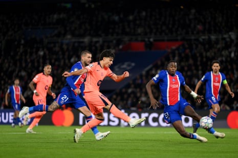 Xavi Espart of Barcelona strikes the ball toward goal as PSG defenders challenge