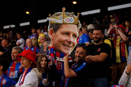 Crystal Palace fans hold up a cutout of manager Oliver Glasner