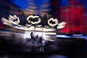 A child rides on a carousel at the Christmas market in Mulhouse, France