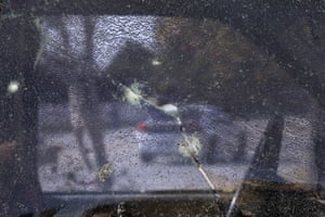The window of a pickup truck shattered by bullets fired during a police shootout in San Bernardino