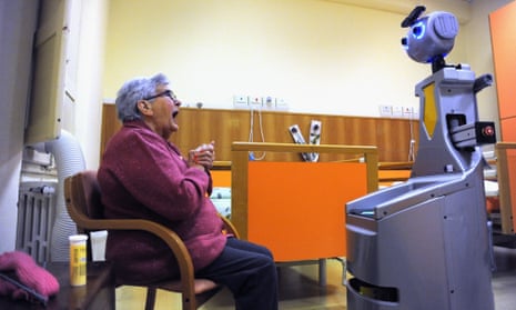 A robot acts as a caregiver or butler for guests at a home for elderly people in Italy.