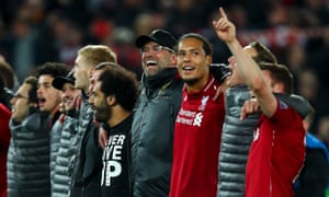 Jürgen Klopp linked arms with his players and staff after the final whistle