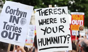 Protest posters at a rally in Whitehall on Saturday.