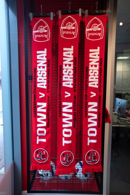 A red scarf with the lettering of both Fleetwood Town and Arsenal