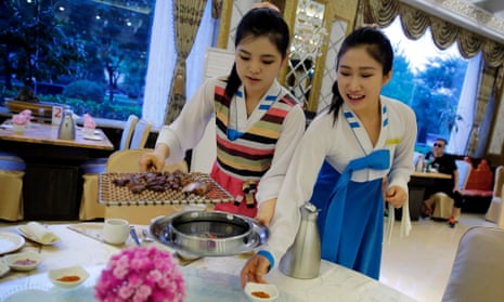 North Korean waitresses serve guests at a restaurant in Beijing, China. The US has called for all countries not to host ‘guest workers’ from Kim Jong-un’s regime.