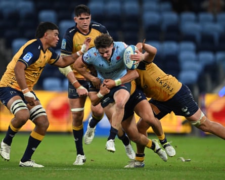 Teddy Wilson runs the ball for the Waratahs
