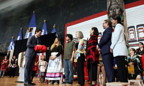 Canada’s prime minister, Justin Trudeau, is presented with the final report during the closing ceremony of the National Inquiry into Missing and Murdered Indigenous Women and Girls in Gatineau, Quebec, on Monday.