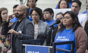 Gisselle Contreras, at podium, daughter of an immigrant detained at Adelanto, California, describes her father’s housing conditions before his final deportation to Guatemala.