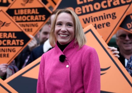 Helen Morgan of the Liberal Democrats in front of her party’s orange flags at a byelection