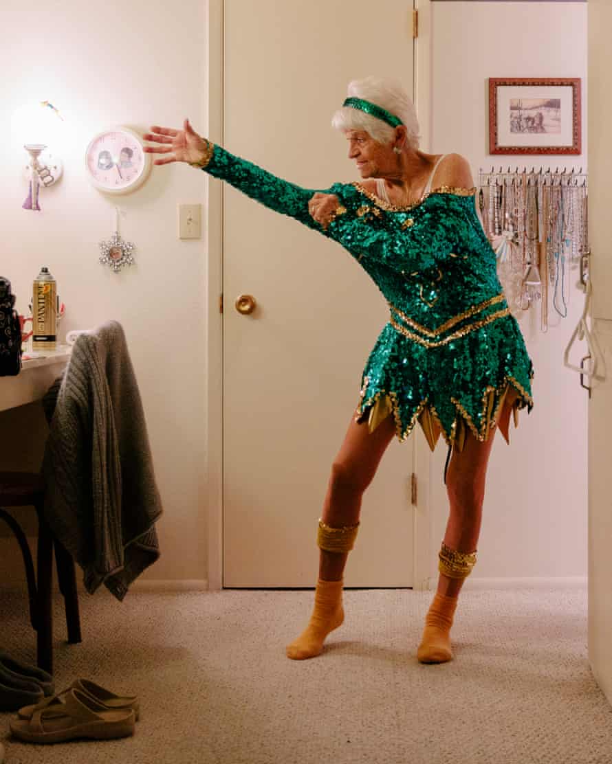Mary Zirbel of the Sun City Poms cheerleading group gets her costume on