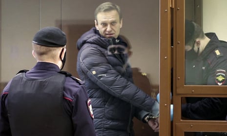 Alexei Navalny in a glass cell during a court hearing in Moscow.