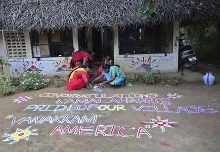 Indian women prepare a Kolam, a traditional art work using colored powder, congratulating U.S. Vice President-elect Kamala Harris in Thulasendrapuram, south of Chennai, Tamil Nadu state, India, in November 2020.