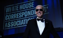 Biden in bow tie and shades with sign behind him saying: White House Correspondents' Association
