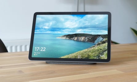 The Pixel Tablet docked in hub mode showing photos.