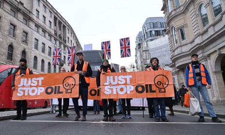 Just Stop Oil climate activists march in central London as part of their campaign calling on the UK government to end approval for exploring, developing and producing fossil fuels.