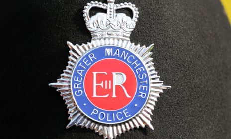 A Greater Manchester police badge on a helmet
