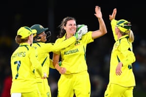 Tahlia McGrath of Australia celebrates with team mates after dismissing Sophie Ecclestone of England.