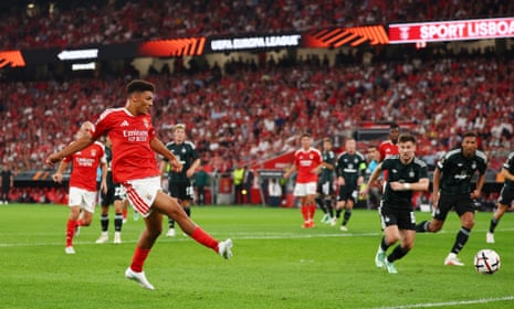 Benfica’s Alexander Bah kicks the ball during a Europa League match in a packed stadium