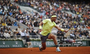 Rafael Nadal plays a backhand return to Roger Federer.
