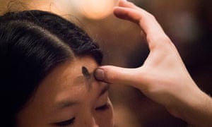 A woman receives ashes at Saint Patrick's Cathedral on Ash Wednesday in New York in 2013
