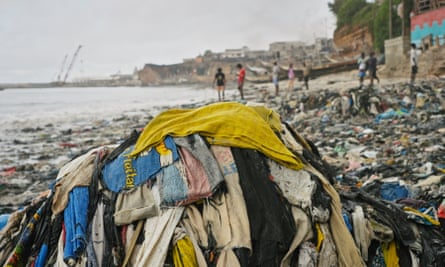 pile of discarded clothes on beach