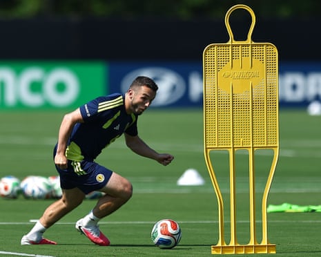 John McGinn goes past a wall dummy during a Scotland training session.