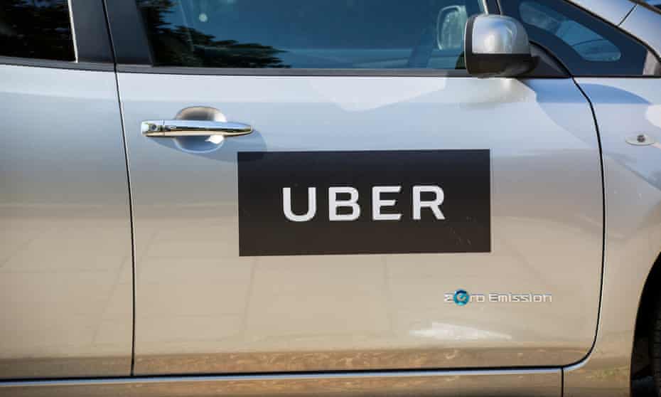 A car marked with an Uber logo