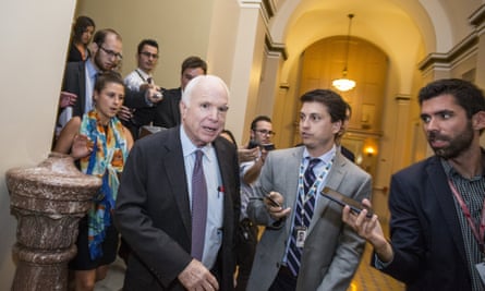 McCain leaves the Senate chamber after voting against ‘skinny repeal’ of the Affordable Care Act in July 2017.