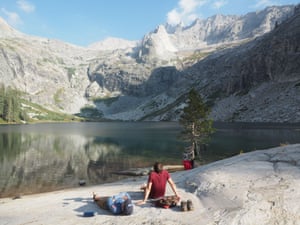 Resting and soaking up sublime mountain scenery beside the largest of Hamilton Lakes, High Sierra Trail , Sierra Nevada