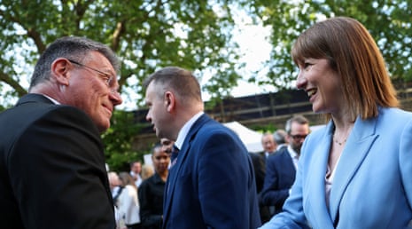 Maroš Šefčovič shakes hands with Britain’s chancellor of the exchequer, Rachel Reeves, during a reception for UK and EU businesses in London on 19 May.