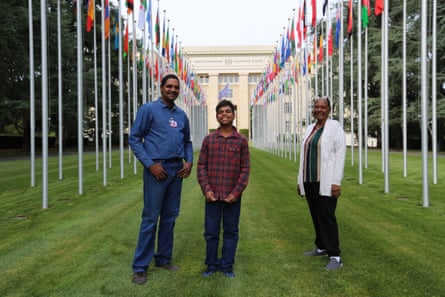 Dujuan Hoosan with his father (l), James Mawon, and grandmother (r), Margaret Anderson, in front of the United Nations building in Geneva.
