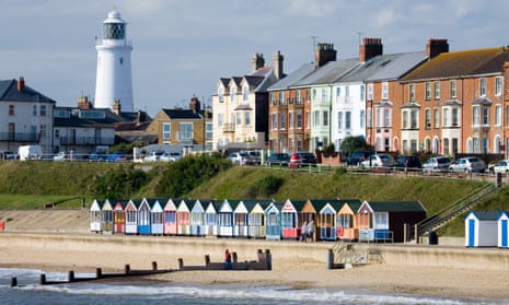 Lighthouse and beach huts at Southwold, Suffolk.