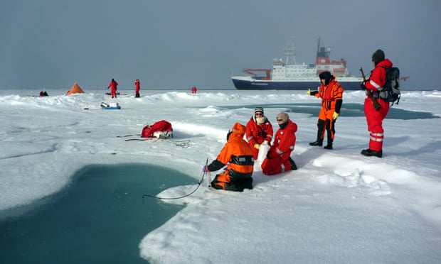 AWI scientists sample a melt pond on Arctic sea ice, discovering record levels of microplastics.