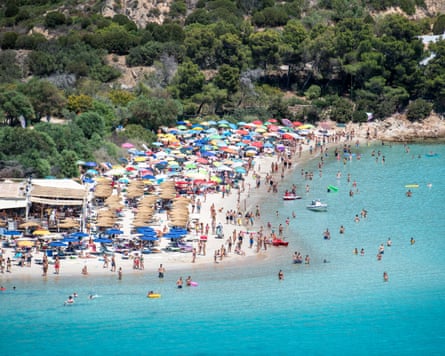 Aerial view of beach umbrellas at Punta Molentis