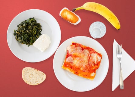 pizza on one plate the spinach and cheese on another, with the rest of lunch placed around them
