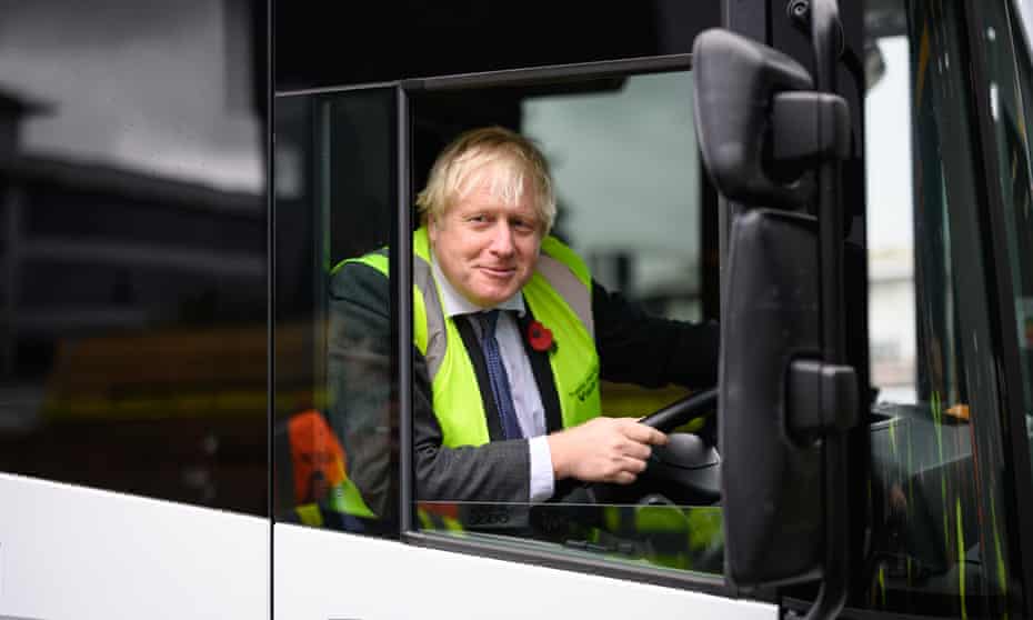 Boris Johnson behind the wheel of a bus.