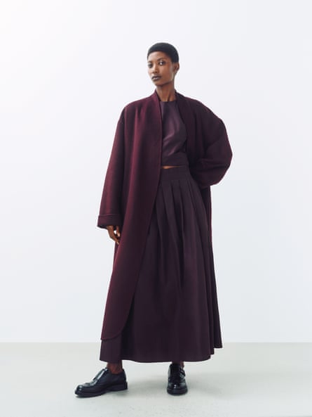 model wearing Wrap Double Front Coat, £159.00 Berry Taffeta Top, £39 , Berry Taffeta Skirt, £59 Black Groove Loafer, £89 johnlewis.com