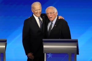 Democratic presidential candidates former Vice President Joe Biden and Sen. Bernie Sanders (I-VT) share a moment during the Democratic presidential primary debate in the Sullivan Arena at St. Anselm College on February 07, 2020 in Manchester, New Hampshire.