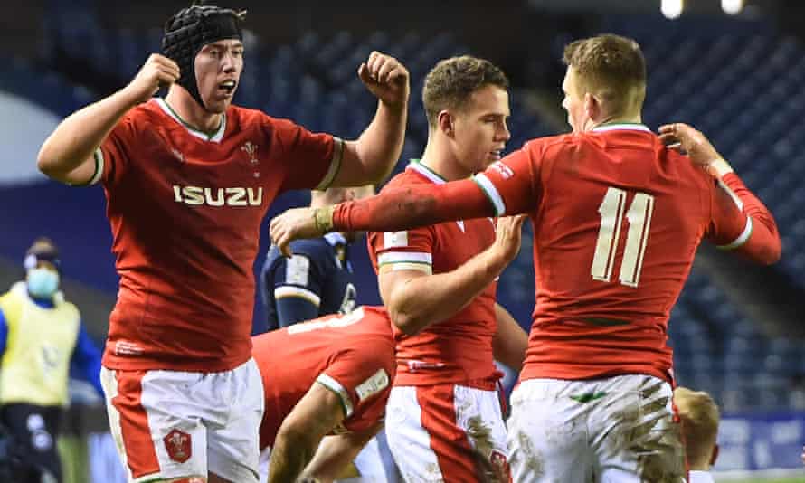 Wales players celebrate their victory over Scotland